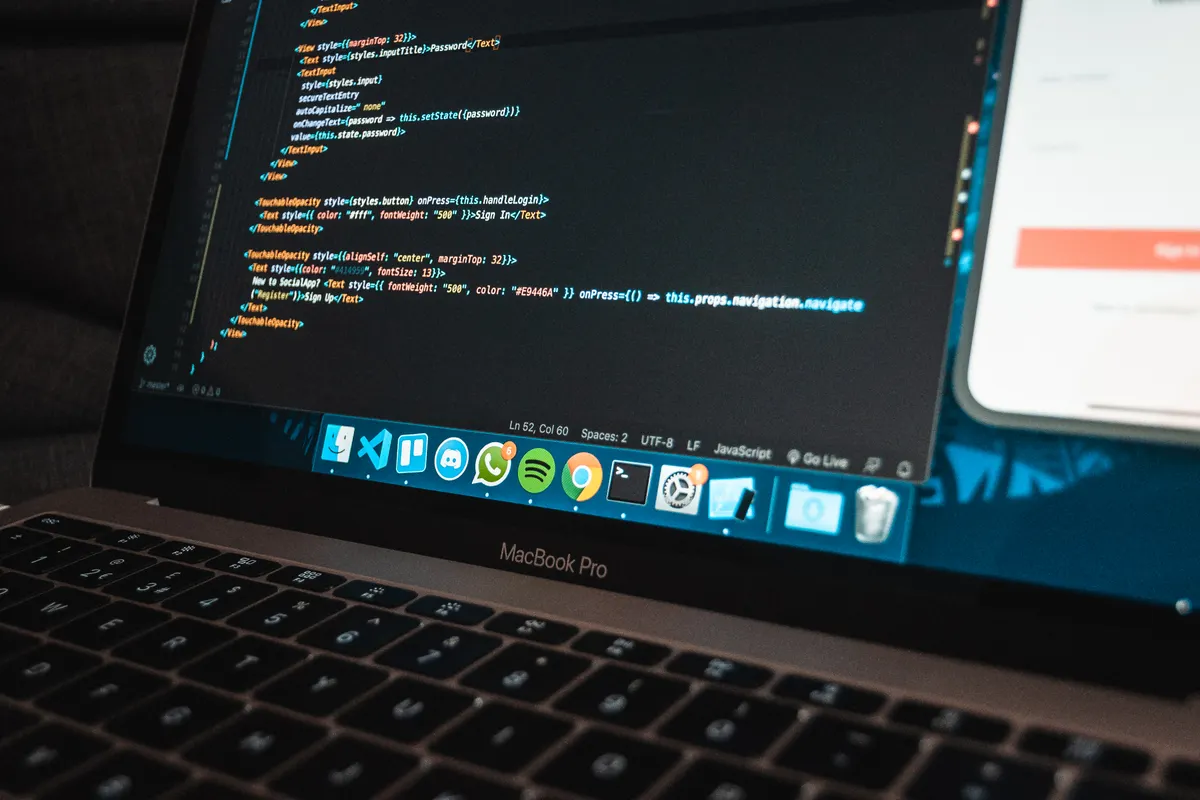Laptop showing a code editor next to a mobile emulator, the setup for an Android debugging interview