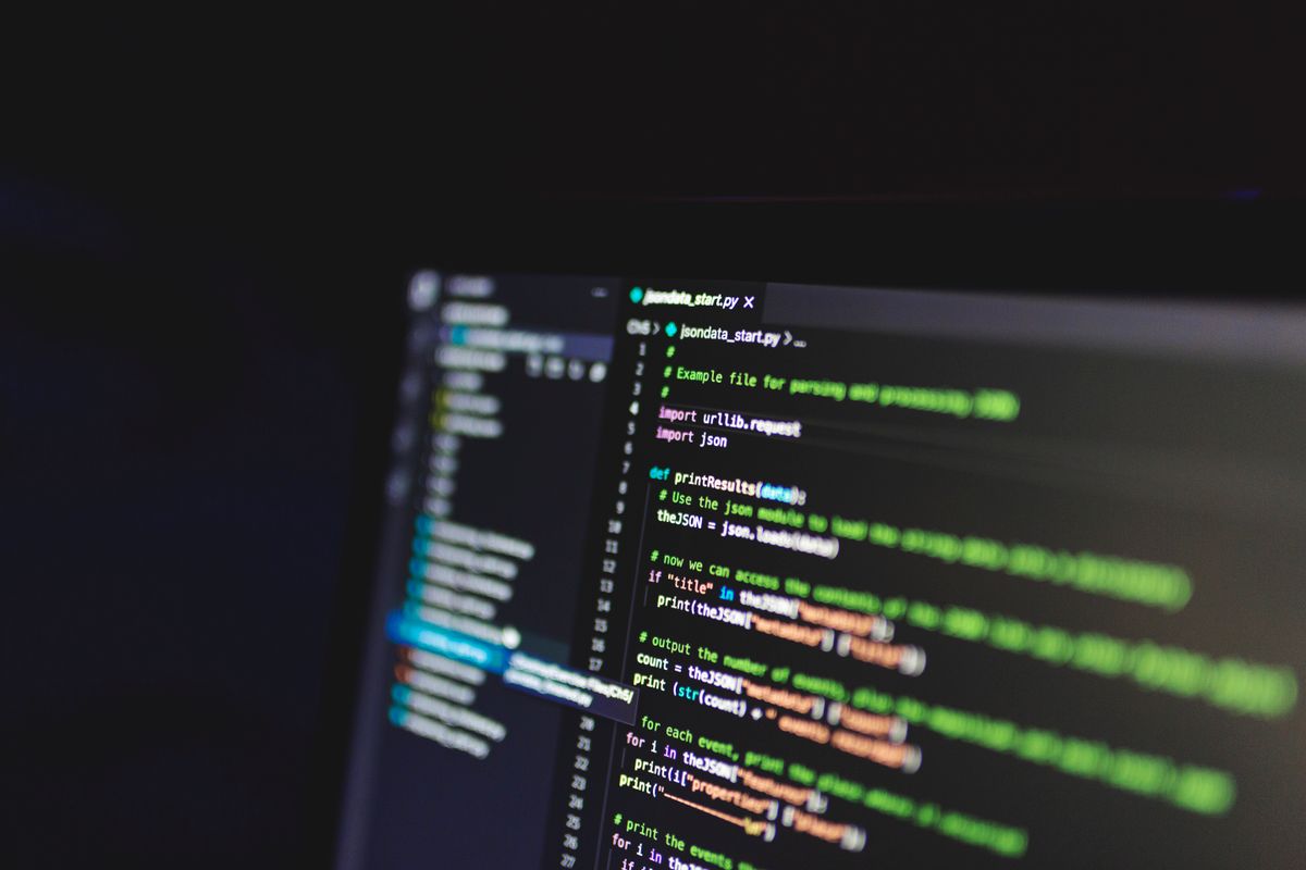 Code editor on a dark monitor showing JSON parsing code, illustrating Gson null fields in an Android release build