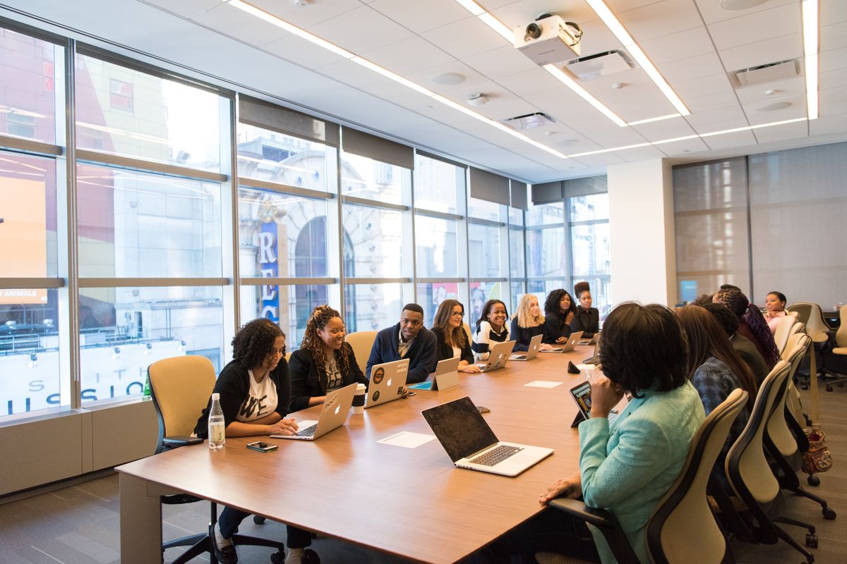A hiring panel reviewing notes together, the kind of debrief that decides who gets rejected after a good interview
