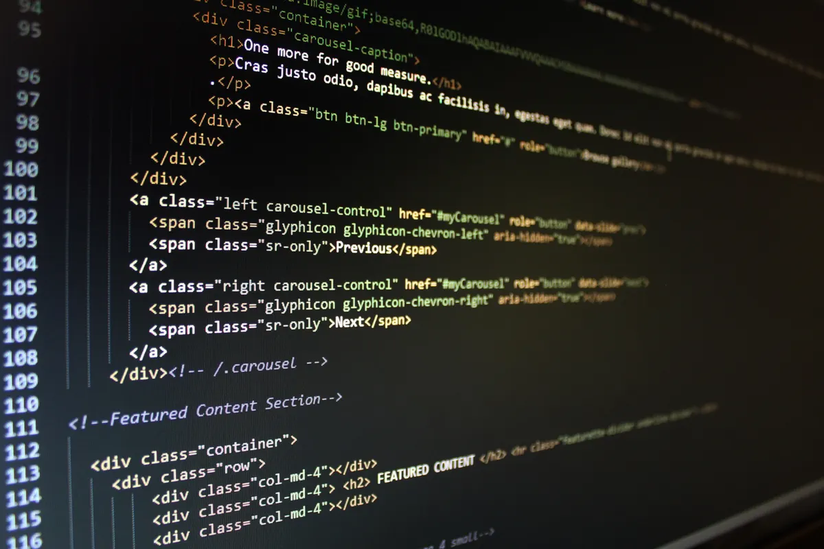 Code on a monitor at an angle, illustrating a KeyPermanentlyInvalidatedException bug in Android code
