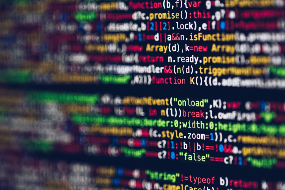 Close-up of colorful source code on a computer monitor