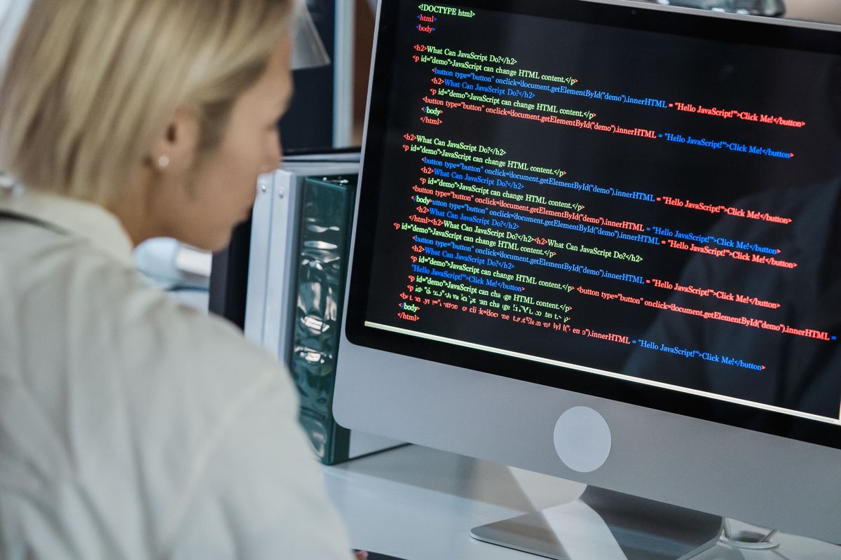 A developer calmly reading code on screen, the kind of unglamorous, methodical work most real engineering stories are actually made of
