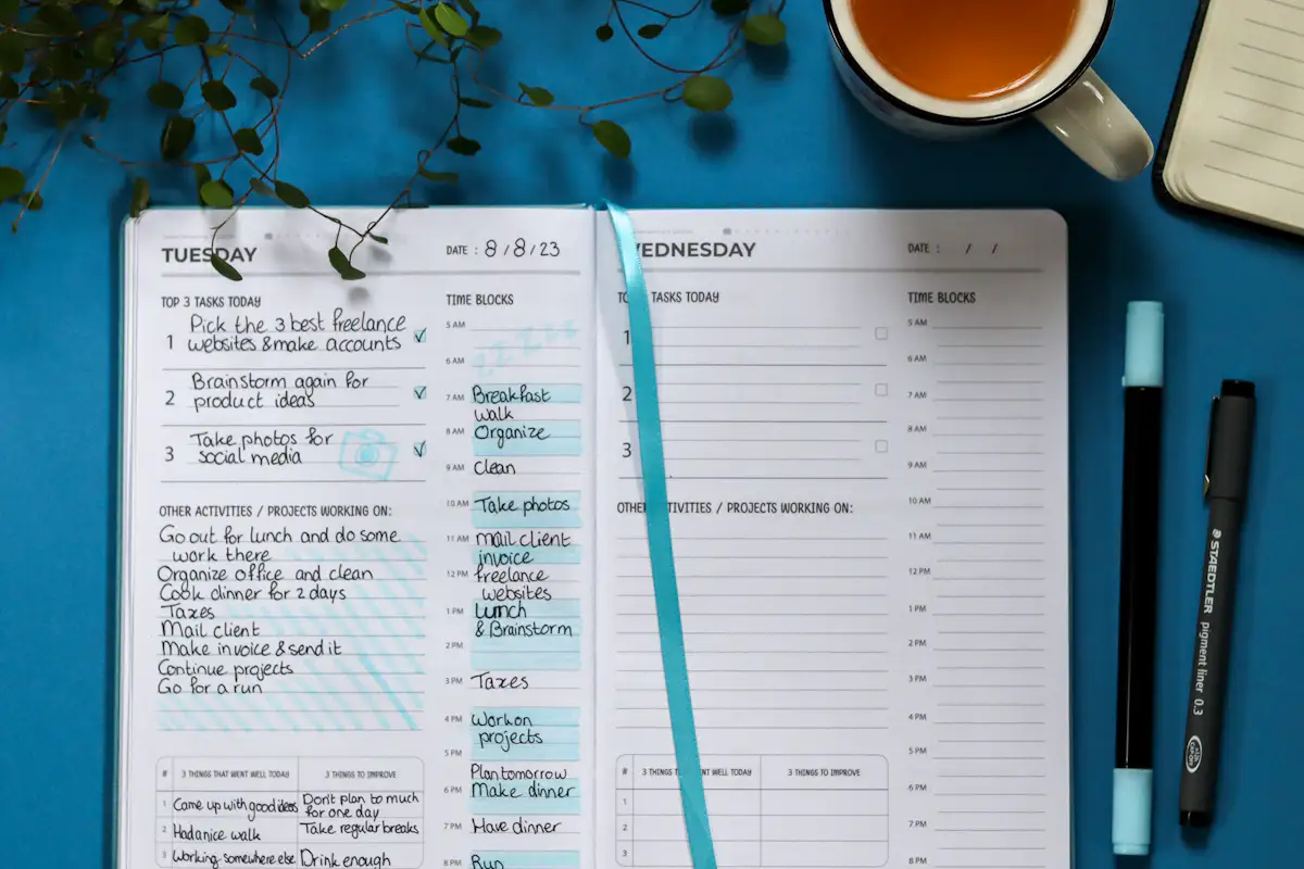 Open planner with a top three tasks list, illustrating the competing priorities interview question