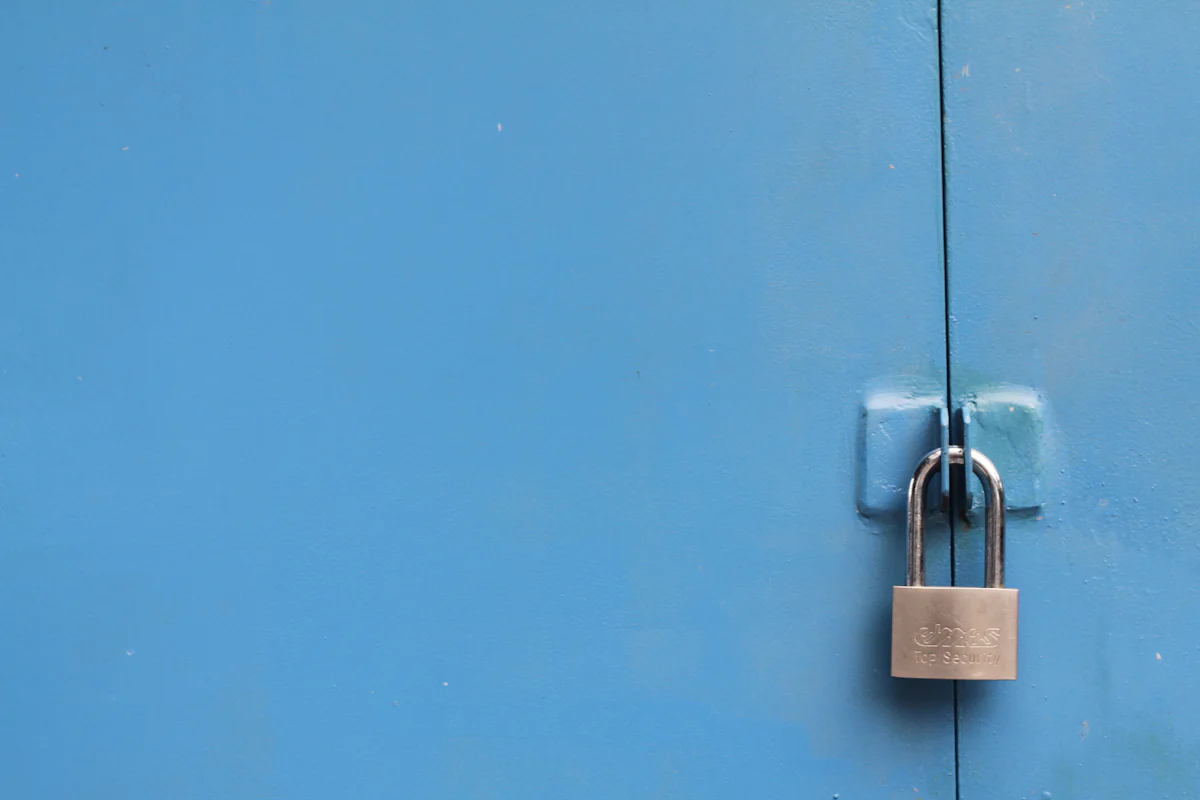 Padlock on a blue metal door, illustrating how data class copy gets around a private constructor